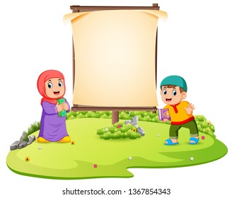 two children are standing in the green garden near the blank banner