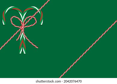 Two christmas candy cane with bow and ribbon on green background. Decoration art. Vector illustration. Stock image