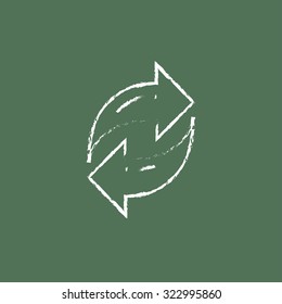 Two circular arrows hand drawn in chalk on a blackboard vector white icon isolated on a green background.