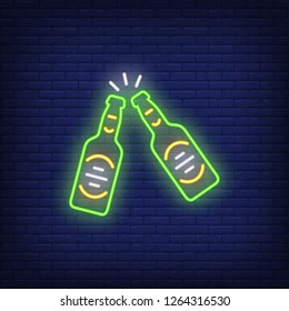 Two clinking beer bottles neon sign. Celebration design element. Night bright neon sign, colorful billboard, light banner. Vector illustration in neon style.