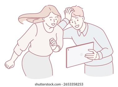 Two close friends happily shared a joyful moment while enthusiastically viewing interesting content on a tablet