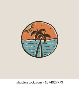two coconut trees on the beach at sunset