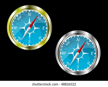 Two compasses in gold and silver with a blue insert with a map of the world isolated on a black background saved on EPS 10 format