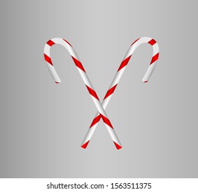 
two confections from a Christmas present crossed on a gray background