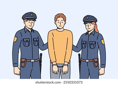 Two cops in police uniforms detained and handcuffed criminal for breaking law or disrespecting detectives. Brave cops fight crime to ensure safety of ordinary city residents who need protection