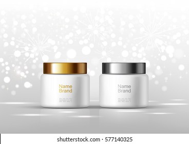 Two cosmetic bottles for cream. White jar and gold, silver glossy lid on the gray background for ads.