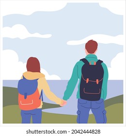 two couple hold hand facing ocean from the top of the hill