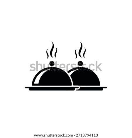 Two covered dishes on a serving tray steaming and awaiting presentation