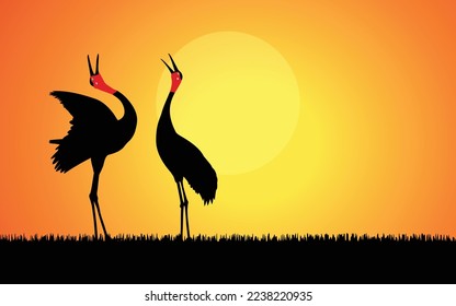 two cranes Vector drawing. Silhouette of a crane posing on a white background. Vector illustration.