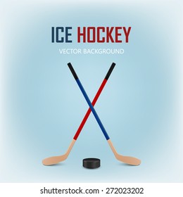 Two crossed hockey sticks and puck. Vector EPS10 illustration. 