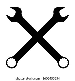 Two crossed mechanics open ended and ring spanner combination in silhouette on a white background