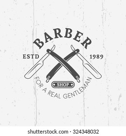 Two crossed straight razors barber shop vector vintage label, badge, or emblem on gray background with grunge texture