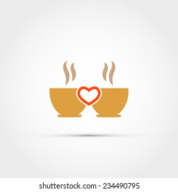 Two cups of coffee with a heart in the middle
