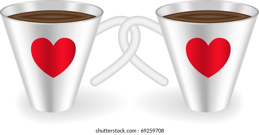 Two cups with intertwined handles decorated with  hearts