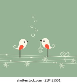 Two cute birds with Christmas decorations. Winter holidays greeting card