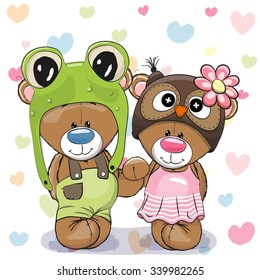 Two Cute Cartoon Bears in a frog hat and owl hat