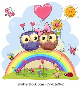 Two Cute Cartoon Owls are sitting on the rainbow