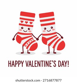 Dos lindos calcetines de dibujos animados tomados de la mano y deseando un feliz día de San Valentín. Los calcetines son de rayas rojas y blancas con corazones.