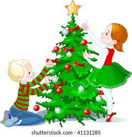 Two cute children decorating a Christmas tree