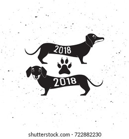 Two cute dachshund dogs, silhouette, logo, Happy new year of the dog 2018 vector illustration