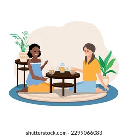 Two cute girls are drinking tea and talking. Tea drinking with friends. Tea time. Vector illustration in a flat style.