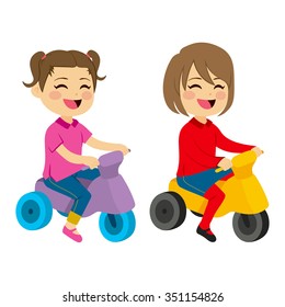 Two cute happy girls with tricycle playing together