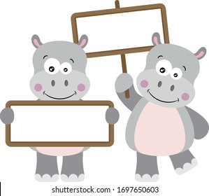Two cute hippos with empty signboards

