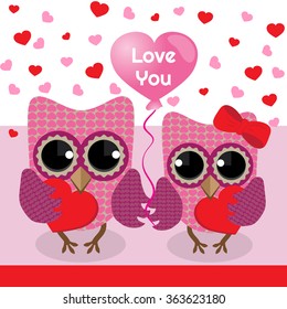 Two cute owls with hearts