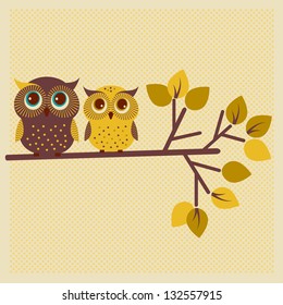 Two cute owls on the tree