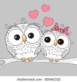 Two Cute Owls is sitting on a brunch
