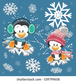 Dos pingüinos cutos vuelan sobre los copos de nieve