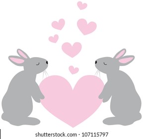 two cute rabbits with a heart