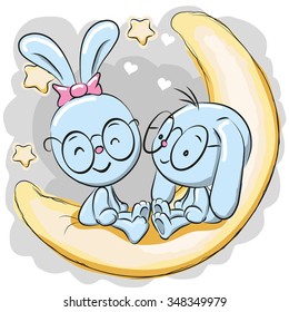 Two Cute Rabbits is sitting on the moon