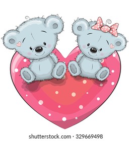 Two cute Teddy Bears is sitting on a heart

