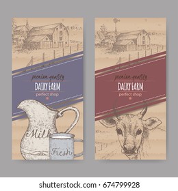 Two dairy labels with farmhouse, cow, color milk pitcher and mug. Placed on cardboard texture. Includes hand drawn elements.