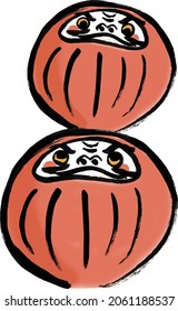 Dos muñecas Daruma encima