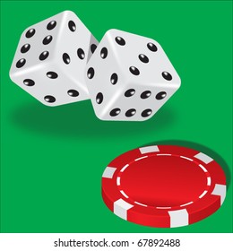 Two dice and red poker chips on green background