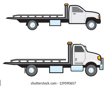Two different types of common American flatbed tow trucks.