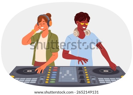 Two DJ use mixing console to entertain visitors to disco in nightclub and play original musical hits. Team of professional DJ with audio equipment for dance festival in club or concert