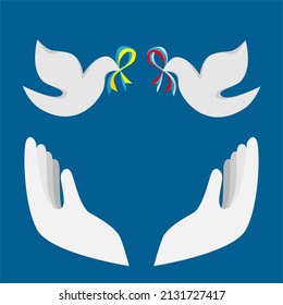 Two doves, a symbol of peace with a ribbons in the color of the Ukrainian and Russian flags in hands