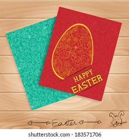 Two Easter cards on a wooden background