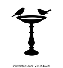 Two elegant black bird silhouettes gracefully perched on a classic garden bird bath illustration