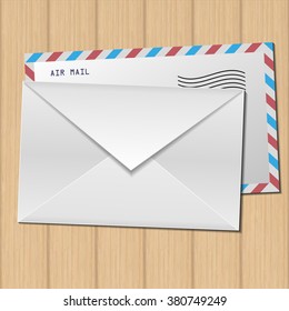 Two  envelopes on wooden background