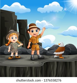 Two explorer kid on the cliff with a bird