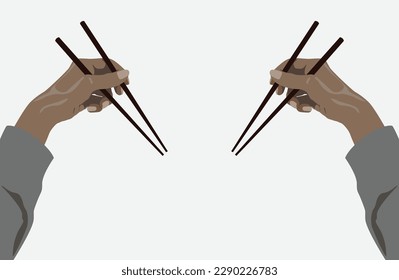 Two female hand holding wooden chopsticks