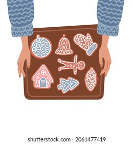 Two female Hands holding baking tray with christmas gingerbread cookies. Top view isolated concept. Flat Vector illustration of winter holidays traditional food.