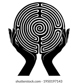 Two female hands holding round spiral maze or labyrinth symbol. Ariadne. Creative concept. Black and white silhouette.