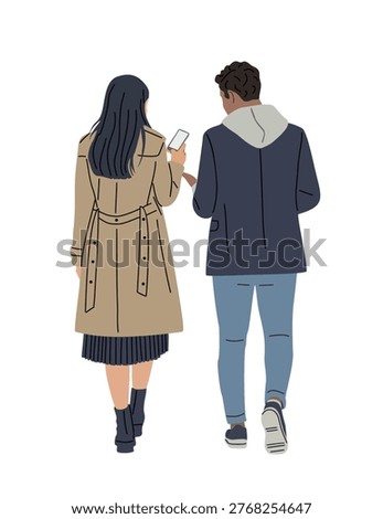 Two figures walk together, holding a phone. Woman wears trench coat, boots, and skirt. Man wears hoodie, jeans, and sneakers. They share focus on screen, suggesting conversation