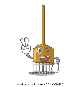 Two finger cartoon rake leaves with wooden stick