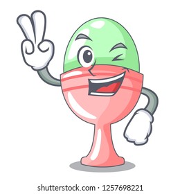 Two finger colored easter egg in cup cartoon